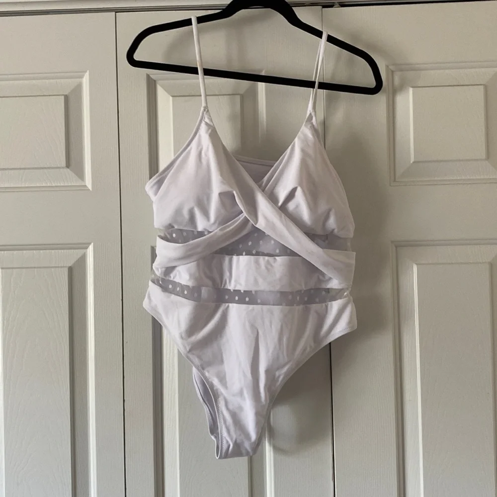 This is ladies swimming suit with pads‎ in the bust area .This suit is new .